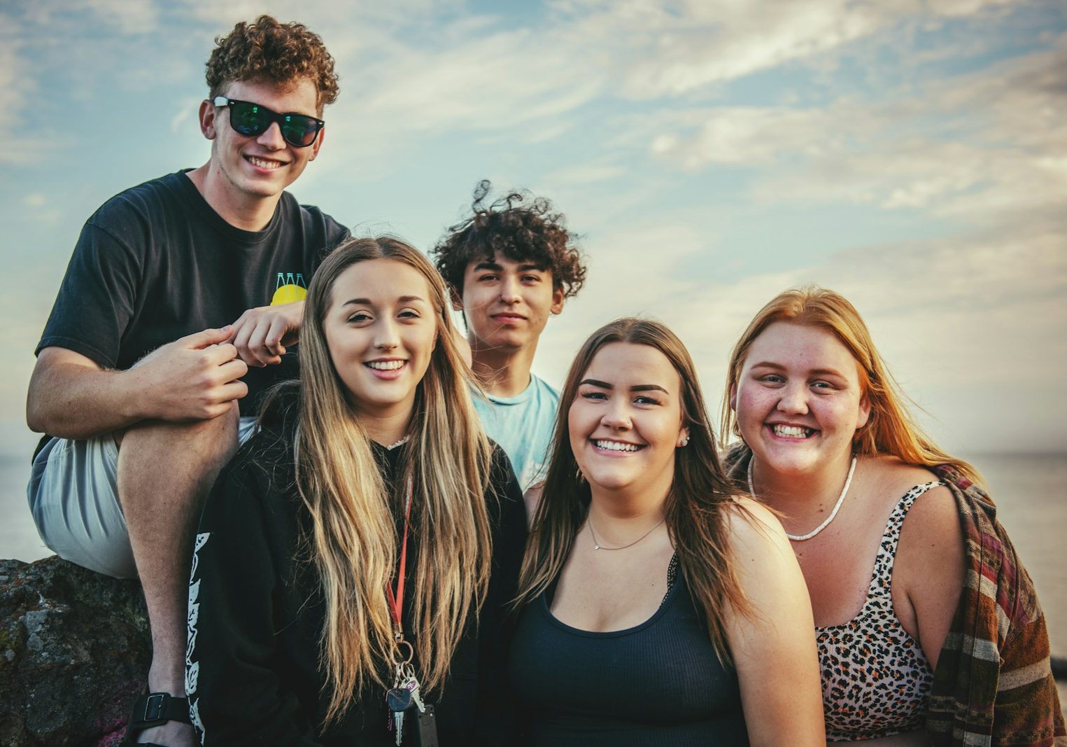 photography of five people near outdoor during daytime
